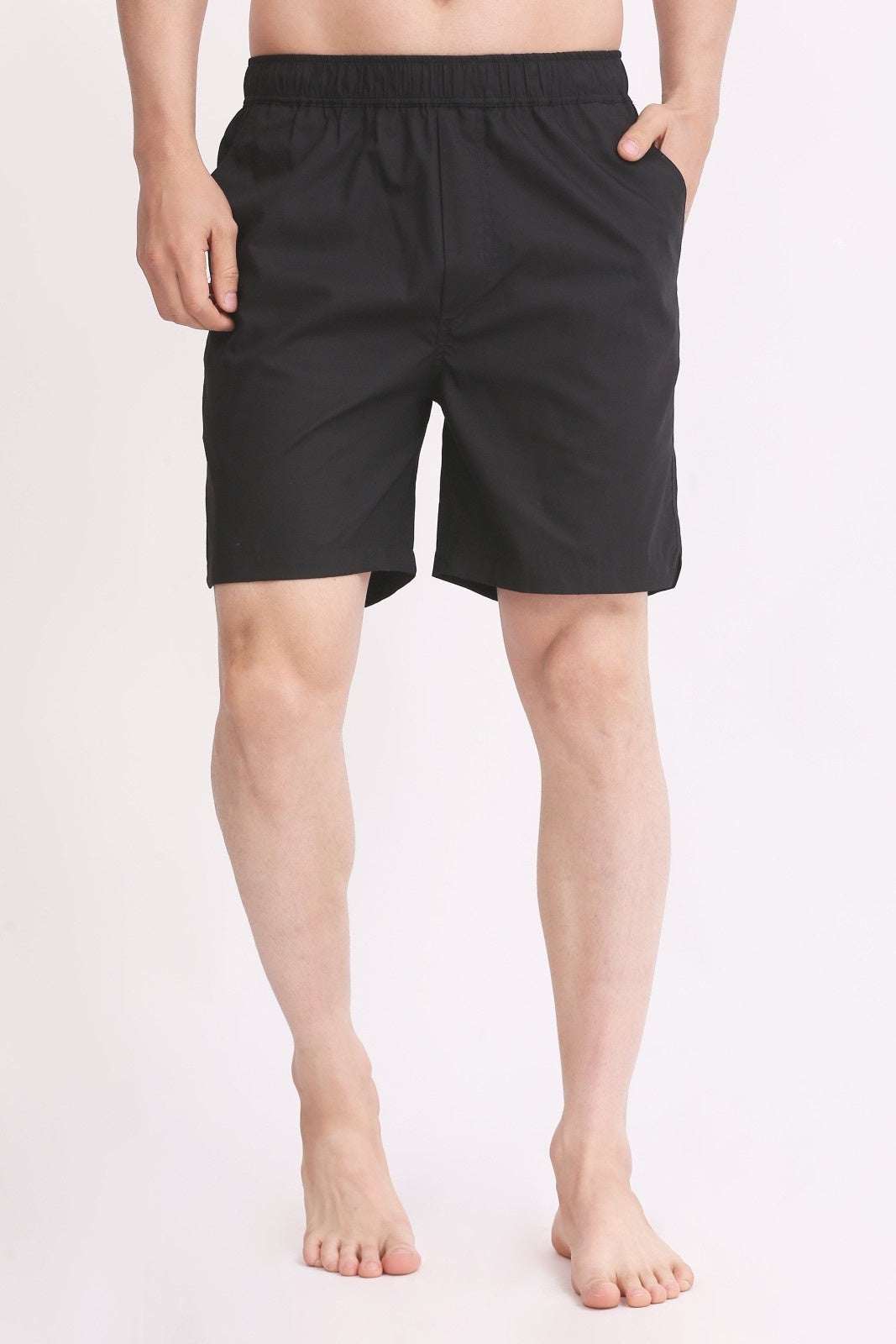 Men's black cotton shorts with elastic waistband and back pocket, knee-length casual fit