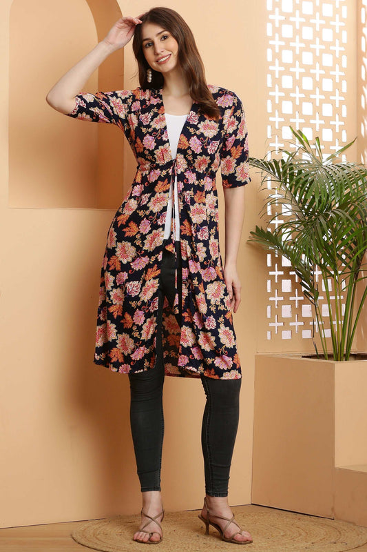 Woman wearing a Rayon printed stylish long multiflower shrug with 3/4 sleeves and open front over casual outfit